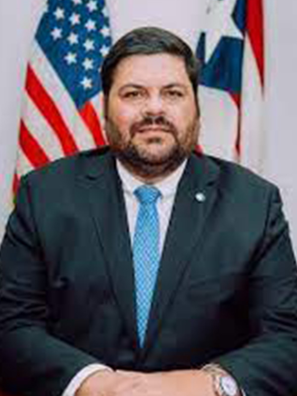 Hon. Carlos Mellado, MD